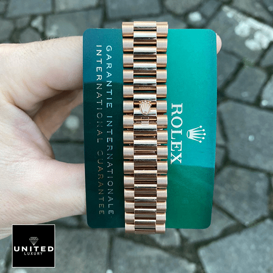 DayDate President 118235 Replica 5 Rolex Day-Date President 118235f-0024 Oyster Bracelet on the Rolex logo & Warranty Card