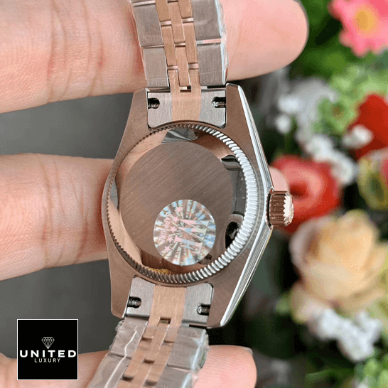 Rolex Datejust 278271 Everose Gold Automatic Chocolate Dial Jubilee Replica 2 Rolex 278271 Stainless Steel Case Jubilee Replica on the hand & flowers